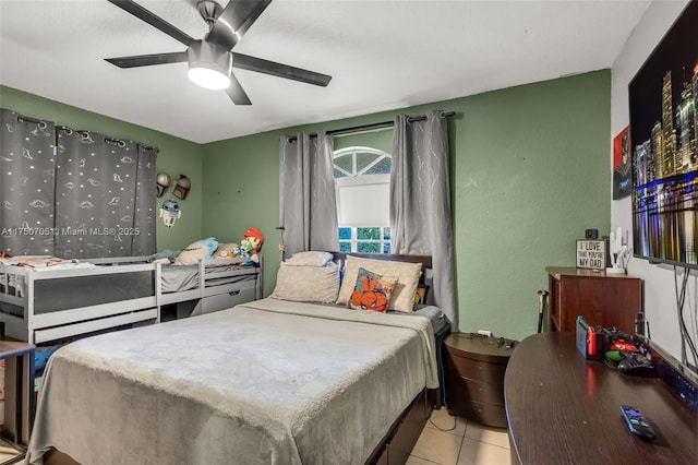 bedroom featuring light tile patterned floors and a ceiling fan