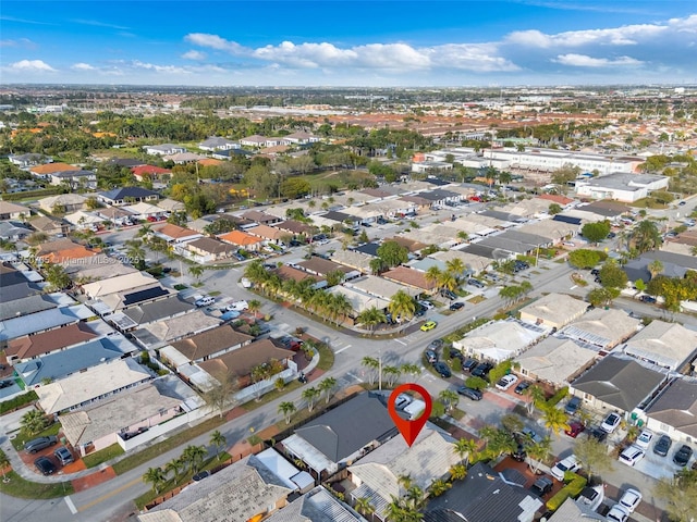 birds eye view of property with a residential view