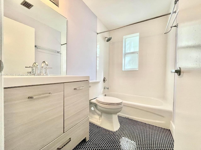 bathroom with toilet, vanity, visible vents, shower / bathing tub combination, and tile patterned floors