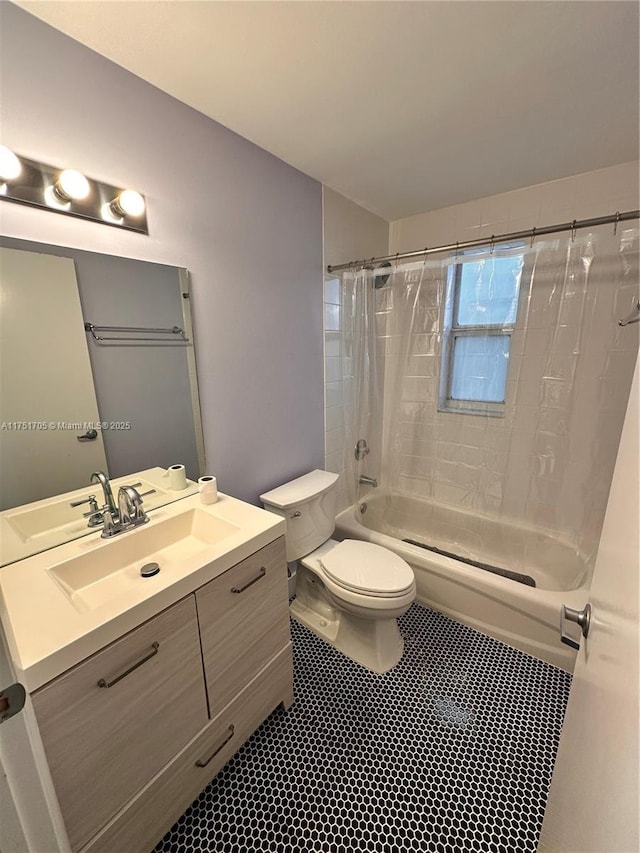 bathroom with shower / bathtub combination, vanity, and toilet