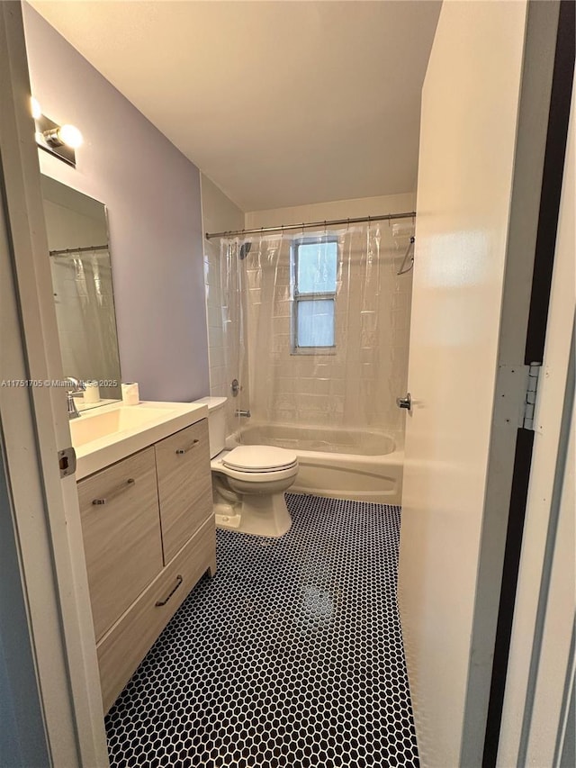 full bathroom featuring shower / tub combo, tile patterned flooring, vanity, and toilet