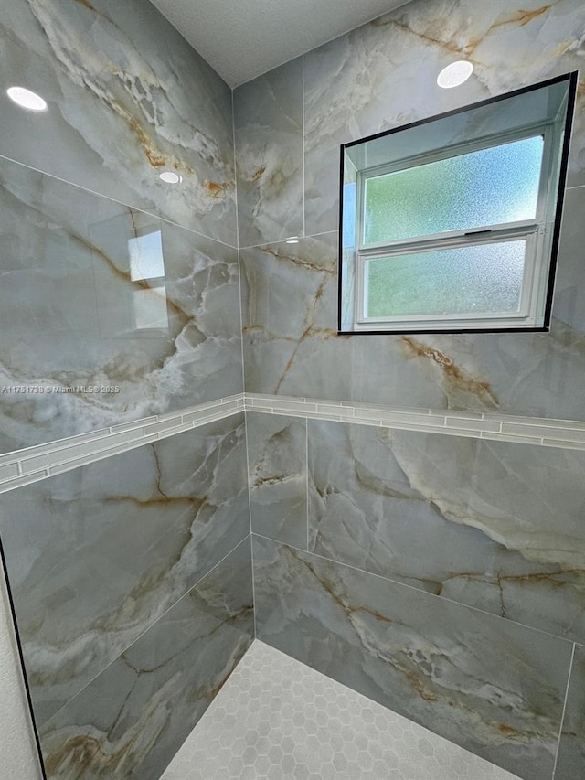 bathroom featuring tiled shower