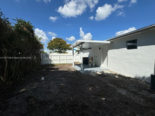 view of yard featuring a patio and fence