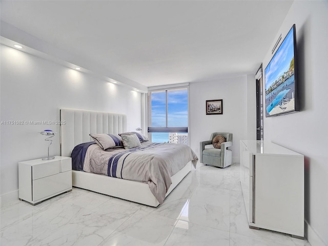 bedroom with marble finish floor, a wall of windows, recessed lighting, and baseboards