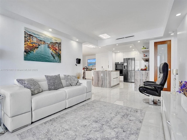 living room featuring recessed lighting and marble finish floor