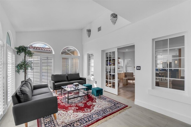 2043 SW 7th St, Miami, FL 33135 - living area featuring visible vents, french doors, and wood finished floors