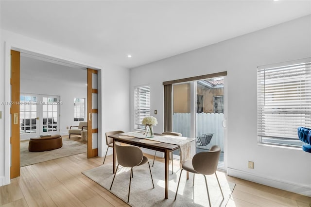 2043 SW 7th St, Miami, FL 33135 - dining space featuring light wood-style floors, baseboards, recessed lighting, and a healthy amount of sunlight