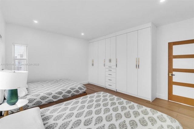 2043 SW 7th St, Miami, FL 33135 - bedroom with recessed lighting, baseboards, and wood finished floors