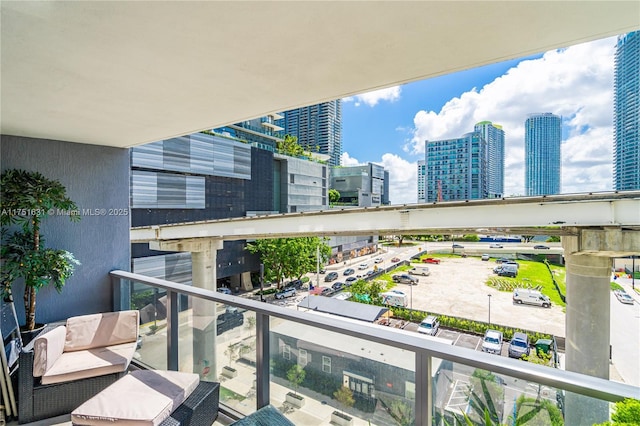 balcony featuring a view of city