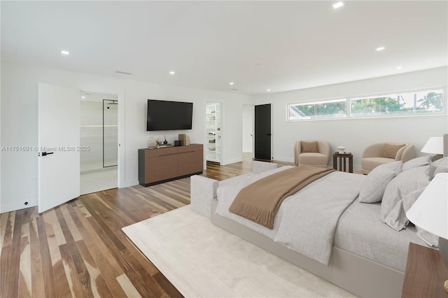 bedroom featuring wood finished floors and recessed lighting