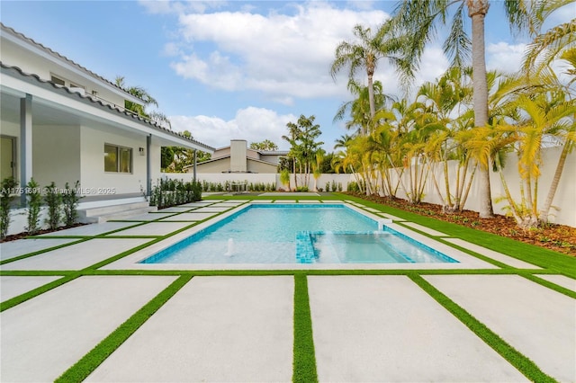 view of pool with a fenced in pool, a fenced backyard, and a patio