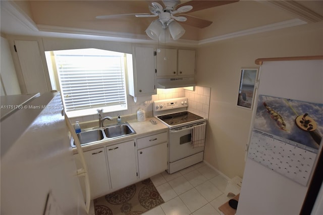 kitchen with under cabinet range hood, electric range, a sink, white cabinets, and light countertops