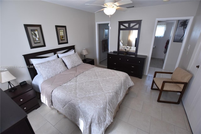 bedroom with light tile patterned floors, ceiling fan, and visible vents