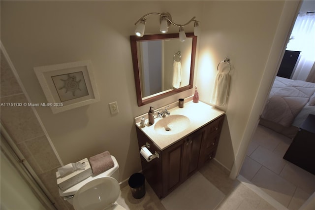 ensuite bathroom with tile patterned flooring, toilet, connected bathroom, vanity, and baseboards