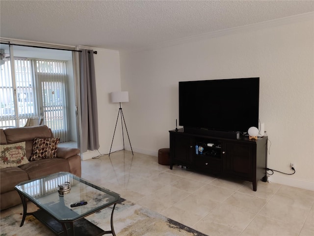 living area with ornamental molding, light tile patterned flooring, a textured ceiling, and baseboards