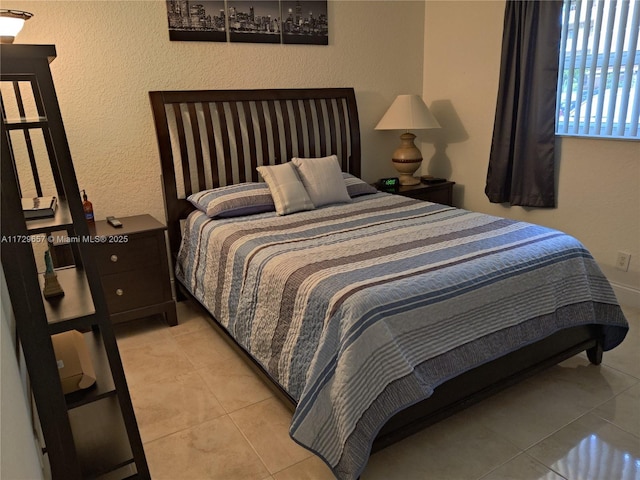 bedroom featuring light tile patterned floors