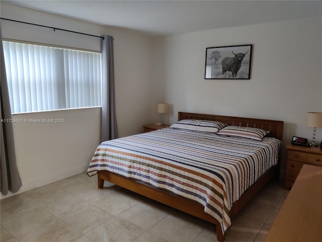 bedroom featuring light tile patterned floors