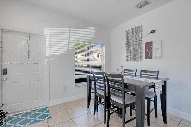 3383 Merrick Ct Unit 1116, Margate, FL 33063 - dining area featuring vaulted ceiling, baseboards, and light tile patterned floors