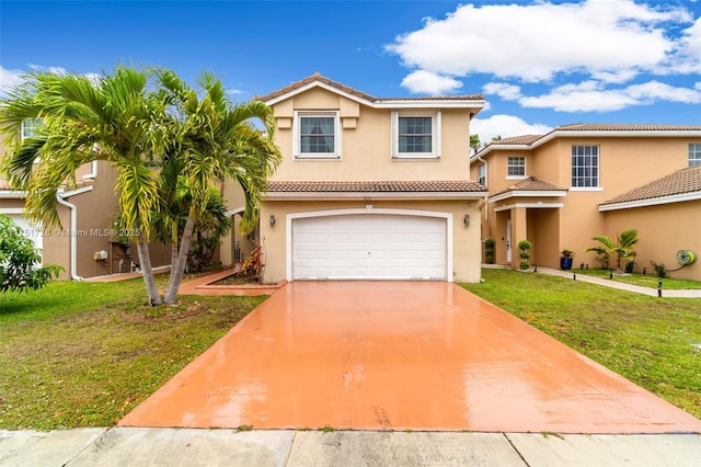 view of front of property featuring driveway, a front lawn, an attached garage, and stucco siding