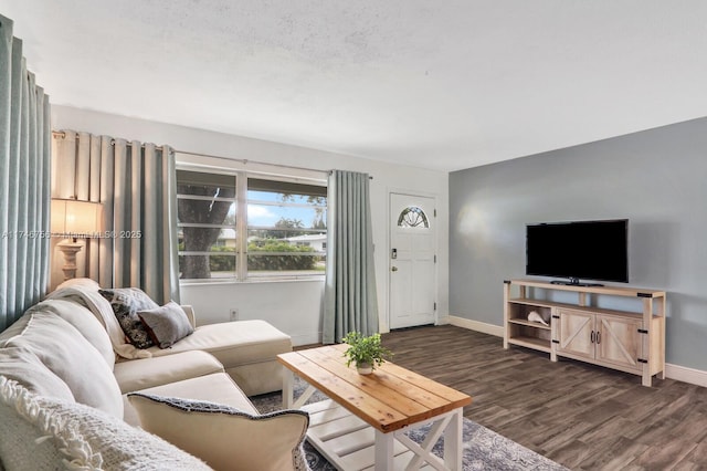 living area with dark wood finished floors and baseboards