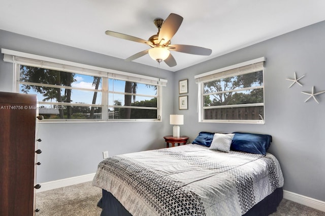 bedroom with carpet floors, ceiling fan, and baseboards