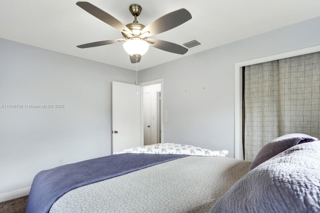 bedroom with ceiling fan, carpet, visible vents, and baseboards