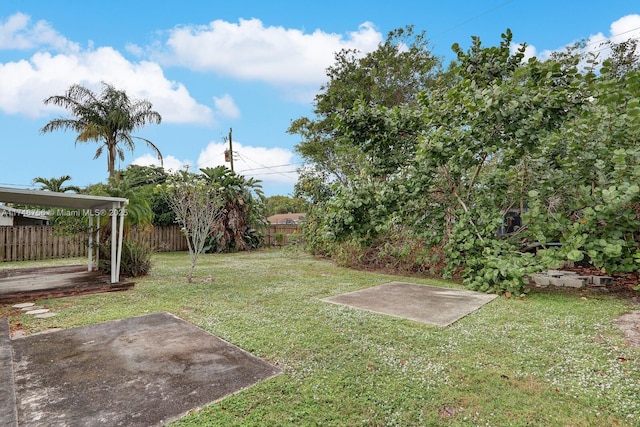 view of yard with a patio and fence