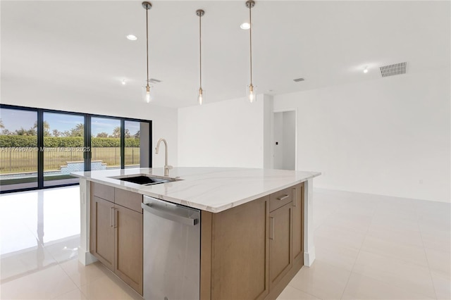 kitchen with light stone counters, a center island with sink, visible vents, stainless steel dishwasher, and a sink