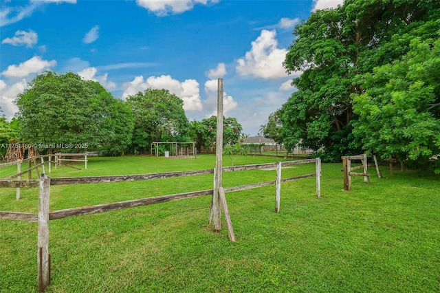 view of yard with a rural view and a playground