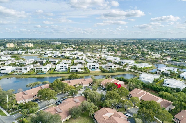 drone / aerial view featuring a water view and a residential view