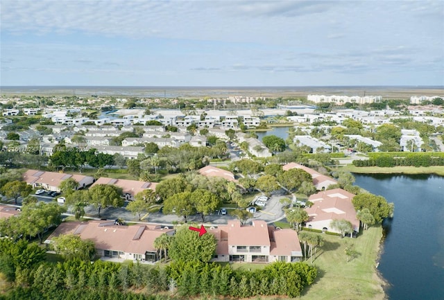 aerial view with a residential view and a water view