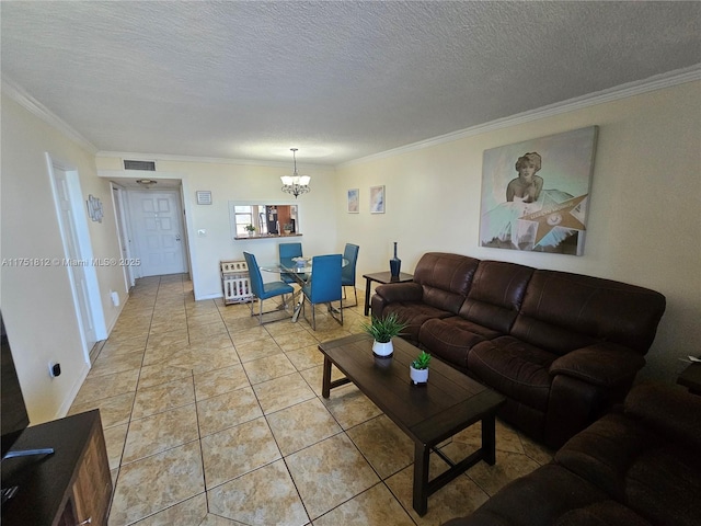 living room with a textured ceiling, ornamental molding, light tile patterned floors, and visible vents