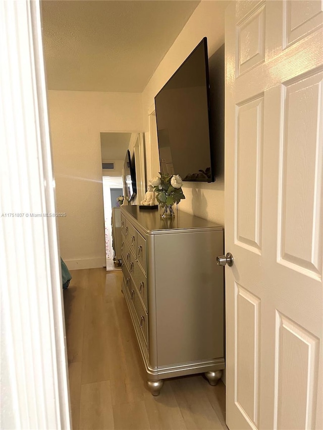 hallway featuring wood finished floors