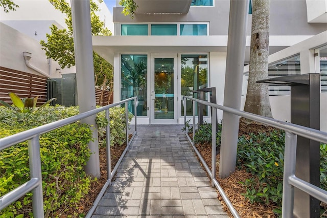 exterior space featuring french doors and stucco siding