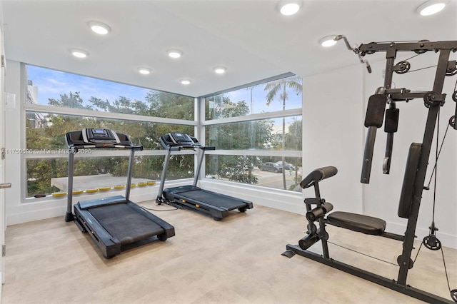 exercise room with recessed lighting