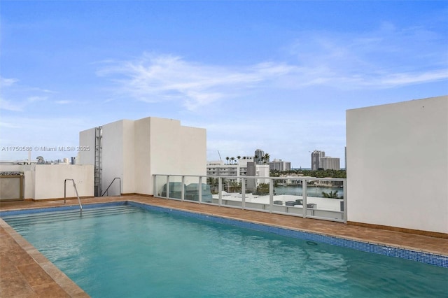 outdoor pool with a water view