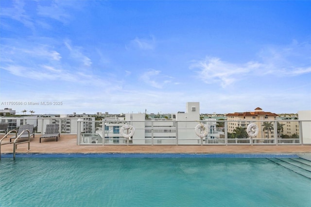 view of pool with a water view