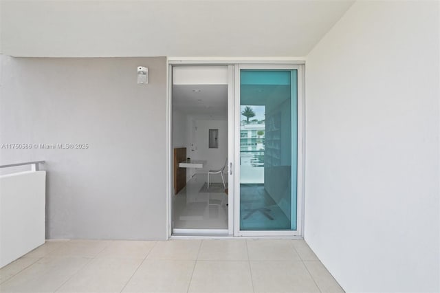 property entrance with stucco siding