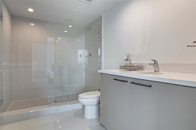 bathroom with a stall shower, toilet, tile patterned flooring, vanity, and recessed lighting