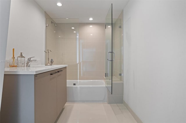 bathroom featuring recessed lighting, bath / shower combo with glass door, and vanity