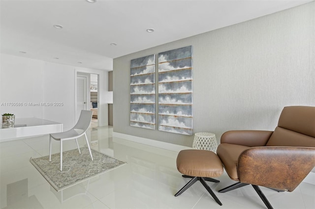 sitting room with light tile patterned floors and recessed lighting