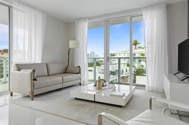 living room featuring floor to ceiling windows