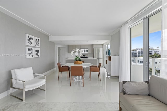 dining space featuring baseboards