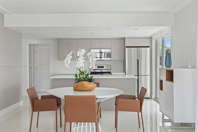 dining room with recessed lighting