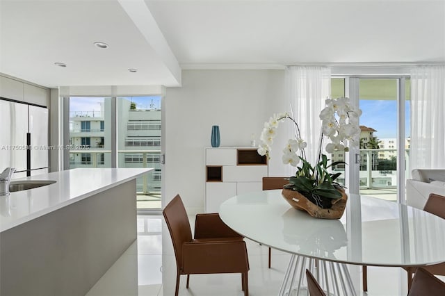 dining space featuring light tile patterned floors