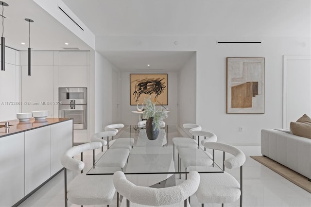 dining room with recessed lighting