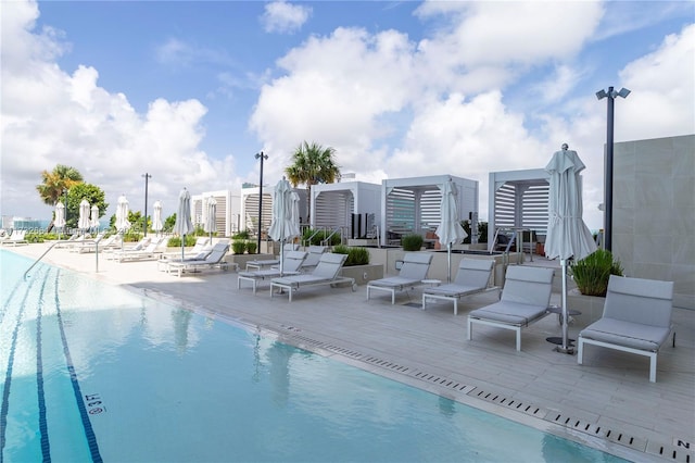 pool featuring a city view and a patio