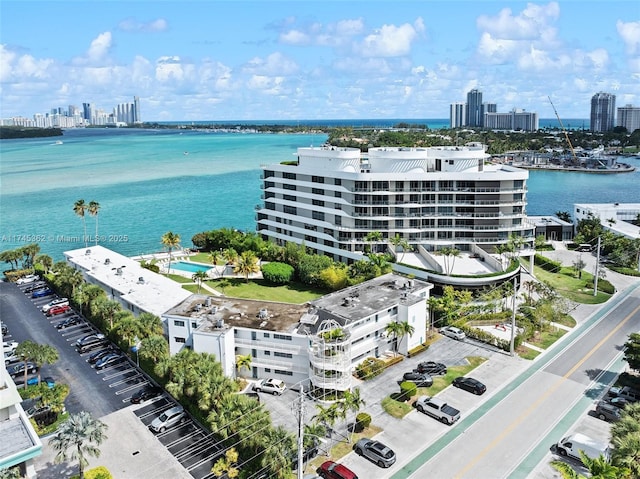 bird's eye view featuring a water view and a city view