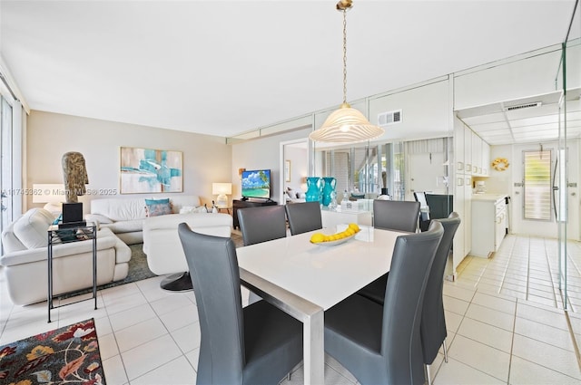 dining room featuring visible vents and light tile patterned floors