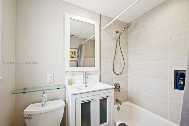 bathroom with shower / tub combo with curtain, vanity, and toilet